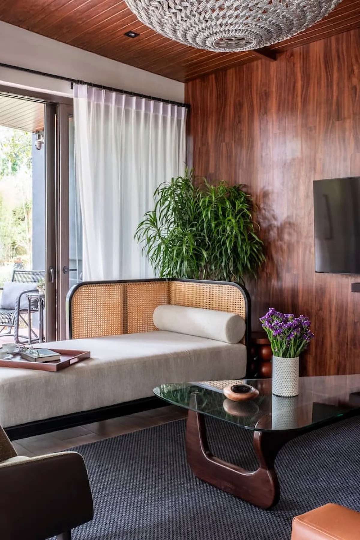 Ezra Viniti standard room interior with mid-century furniture