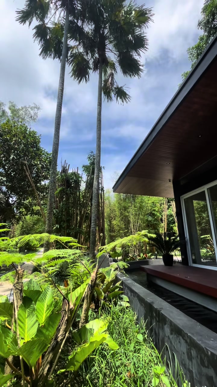 Ezra Viniti Resort exterior with lush tropical greenery